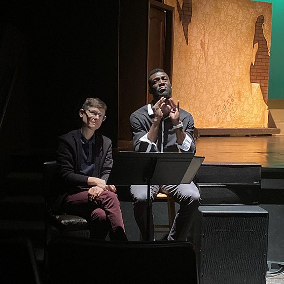 Two American Sign Language interpreters in front of the CTA stage